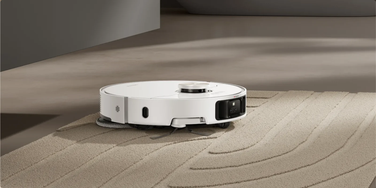 El robot Dreame L50 Ultra limpiando el suelo de un salón luminoso